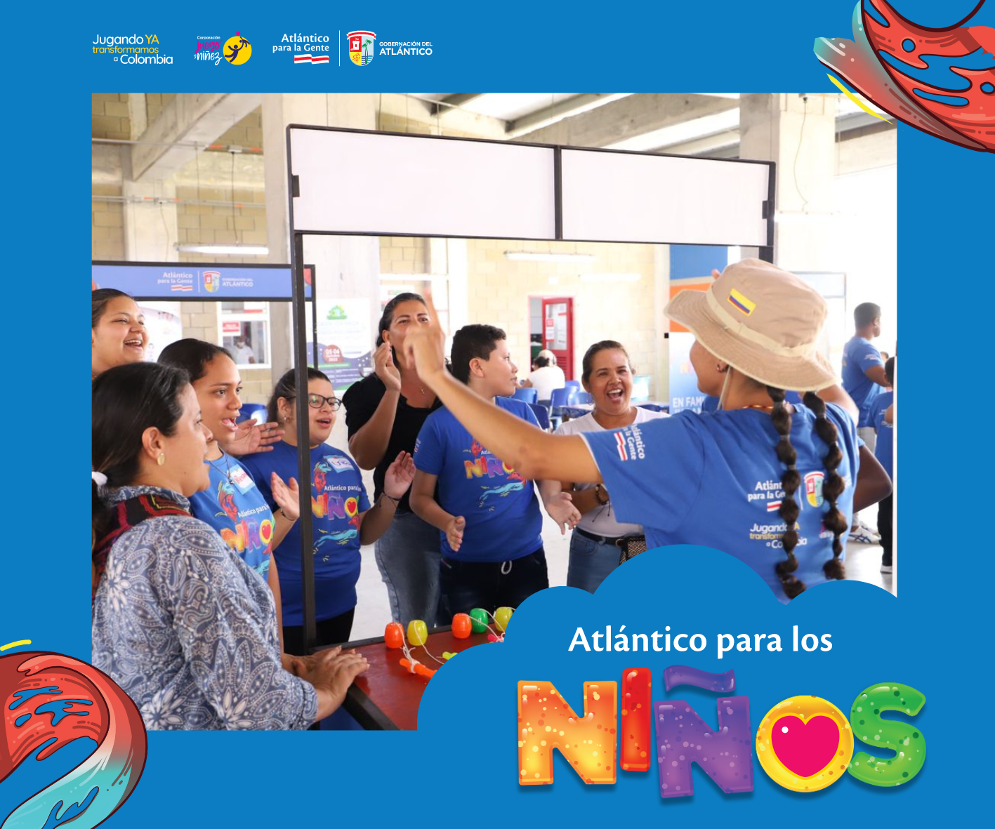 Un grupo de niños y sus madres participando en la estación Juegos Tradicionales de la feria juegos, amor y niñez.
